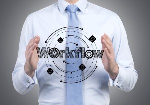 businessman holding workflow scheme in hands - Copyright 2015 Dollar Photo Club by Ivelin Radkov